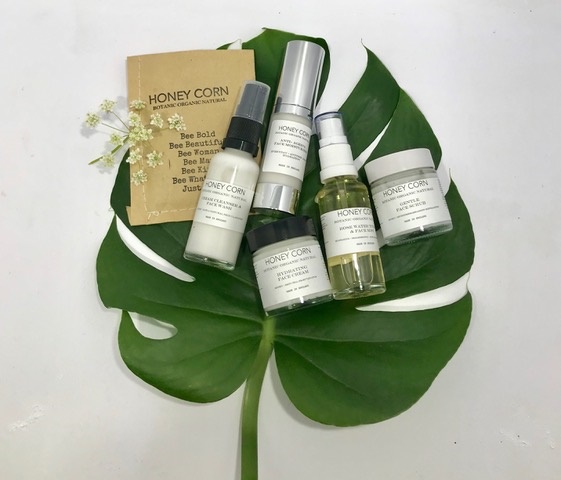 Collection of Honey Corn skincare products.