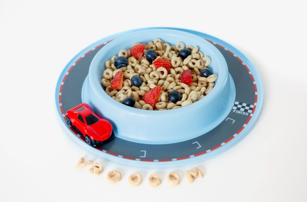 Munchy Play toy with built-in track for toy trains and cars to keep kids focused on their food.